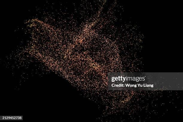 sand particles on dark background - particle stock pictures, royalty-free photos & images