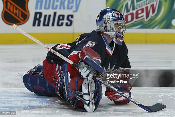 Dan Blackburn of the New York Rangers stretches on the ice before the game against the St. Louis Blues on February 6, 2003 at the Savvis Center in...