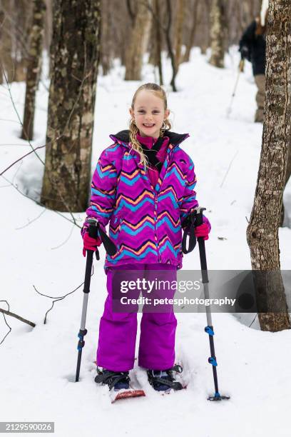 cute young happy girl snowshoeing in winter forest - iwate prefecture stock pictures, royalty-free photos & images