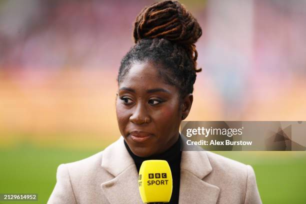 Anita Asante, former Arsenal player looks on whilst working pitchside for BBC Sport prior to the FA Women's Continental Tyres League Cup Final match...