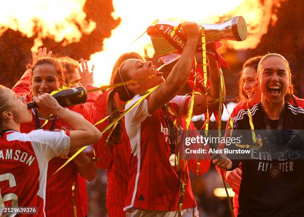 Katie McCabe of Arsenal celebrates with the trophy following the team's victory in the FA Women's Continental Tyres League Cup Final match between...