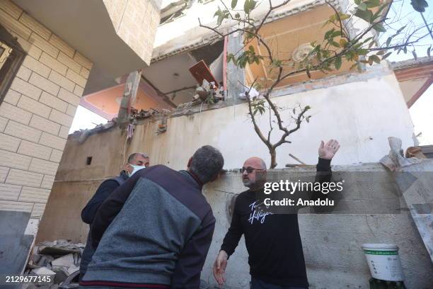 Palestinians are seen at the area after an Israeli attack on Jenin neighborhood in Rafah, Gaza on April 04, 2024. Some houses were damaged as a...