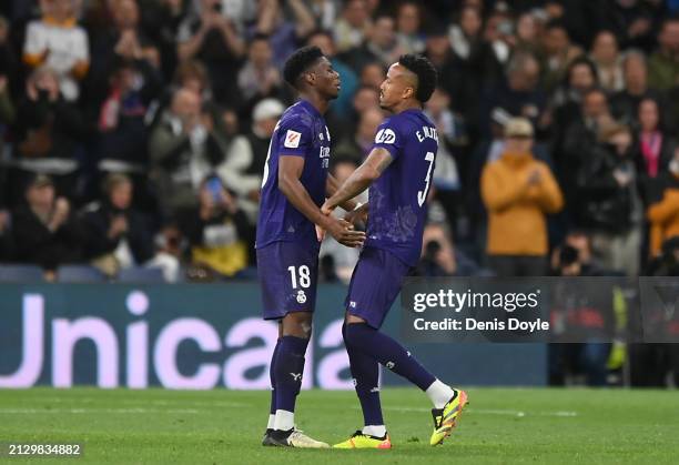 Eder Militao of Real Madrid reacts with Aurelien Tchouameni at the final whistle during the LaLiga EA Sports match between Real Madrid CF and...