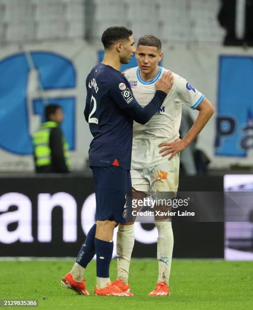 Achraf Hakimi of Paris Saint-Germain react with Amine Harit of Marseille after the Ligue 1 Uber Eats match between Olympique de Marseille and Paris...