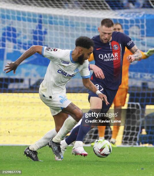 Pierre-Emerick Aubameyang of Marseille in action with Milan Skriniar of Paris Saint-Germain during the Ligue 1 Uber Eats match between Olympique de...