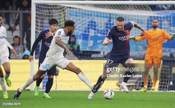 Pierre-Emerick Aubameyang of Marseille in action with Milan Skriniar of Paris Saint-Germain during the Ligue 1 Uber Eats match between Olympique de...