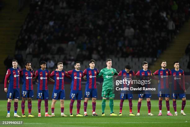 Players of FC Barcelona take part in a minutes silence prior to the LaLiga EA Sports match between FC Barcelona and UD Las Palmas at Estadi Olimpic...