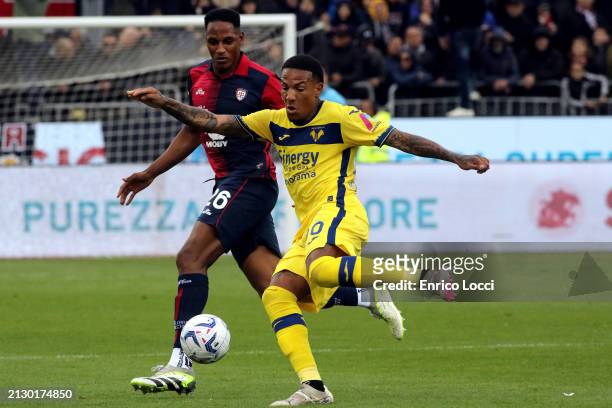 Yerry Mina of Cagliari in contrast during the Serie A TIM match between Cagliari and Hellas Verona FC at Sardegna Arena on April 01, 2024 in...