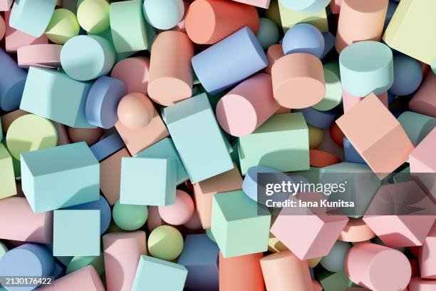 abstract pastel multicolored light blue, pale pink, green, turquoise balls, circles, spheres, cylinders and cubes shape background. 3d pattern. geometric composition. design element. - pastel intensidad del color fotografías e imágenes de stock