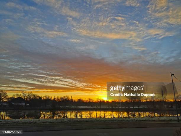 sunrise over a pond in cesson-sévigné in brittany - cesson sévigné stock pictures, royalty-free photos & images