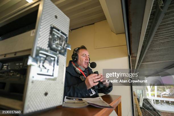 Commentator John Hunt in the commentary box at Kempton Park Racecourse on April 01, 2024 in Sunbury, England.