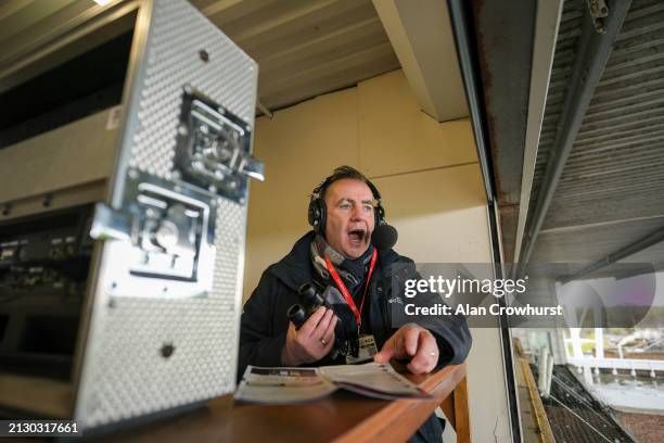 Commentator John Hunt in the commentary box at Kempton Park Racecourse on April 01, 2024 in Sunbury, England.