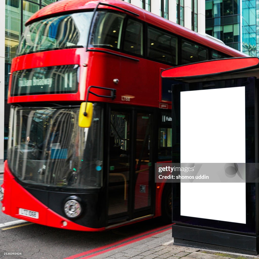 Double decker bus with blank bus stop advertising