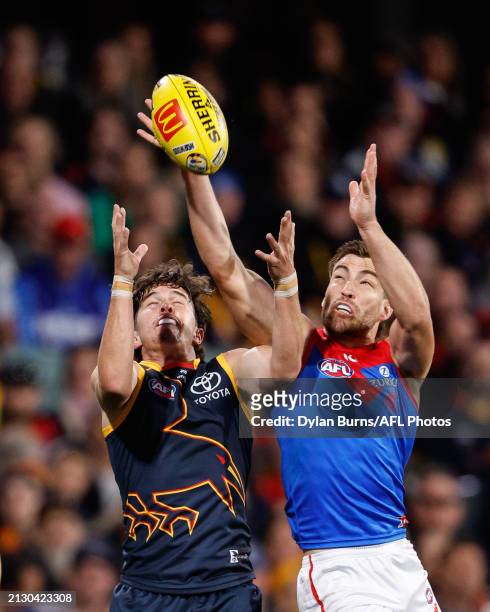 Ned McHenry of the Crows and Jack Viney of the Demons compete for the ball during the 2024 AFL Round 04 match between the Adelaide Crows and the...
