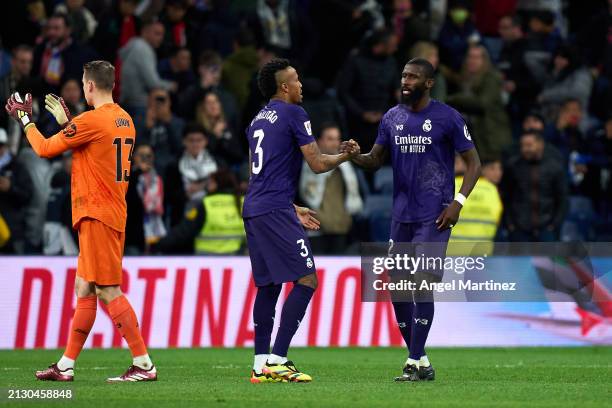 Eder Militao and Antonio Rudiger of Real Madrid shake hands after the LaLiga EA Sports match between Real Madrid CF and Athletic Bilbao at Estadio...