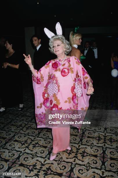 American comedian and actress Phyllis Diller, wearing a pink floral pattern outfit with bunny ears, attends a Friars Club Lifetime Achievement Award...