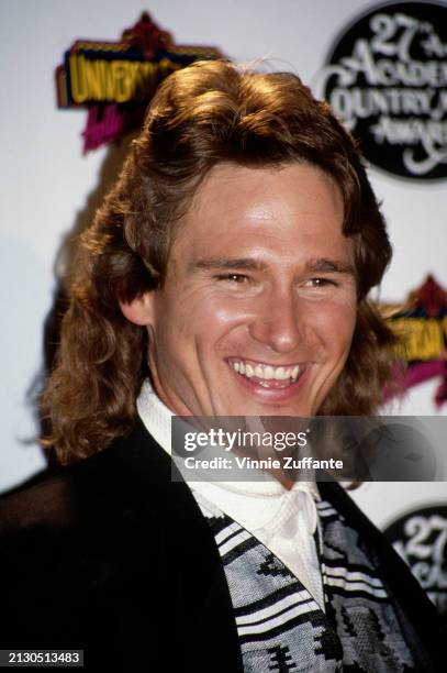 American singer, songwriter and musician Billy Dean, wearing a denim shirt with a brown collar and sunglasses, attends rehearsals in the 27th Annual...