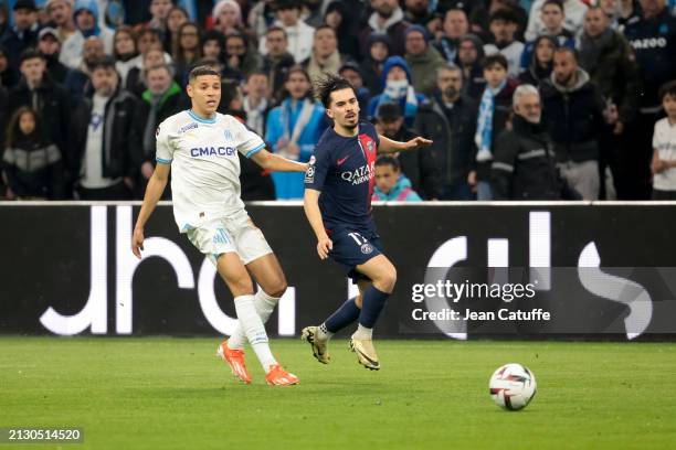 Vitinha of PSG, left Amine Harit of Marseille in action during the Ligue 1 Uber Eats match between Olympique de Marseille and Paris Saint-Germain at...