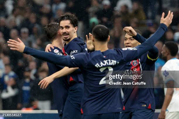 Vitinha of PSG celebrates his goal with Achraf Hakimi, Kylian Mbappe of PSG during the Ligue 1 Uber Eats match between Olympique de Marseille and...