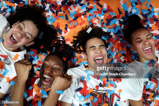 Mimi Collins, Saniya Rivers, Madison Hayes, and Aziaha James of the NC State Wolfpack celebrate after defeating the Texas Longhorns 76-66 in the...