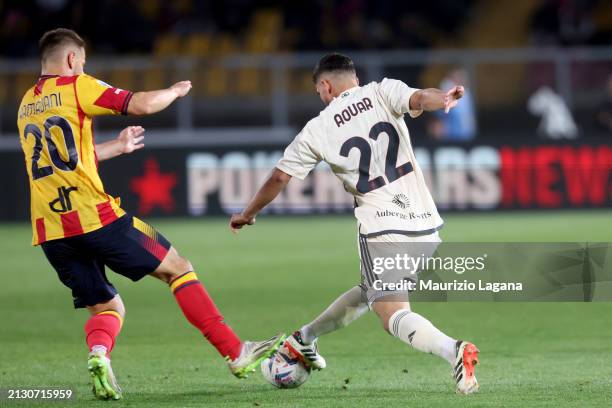 Ylber Ramadani of Lecce competes for the ball with Houssem Aouar of Roma during the Serie A TIM match between US Lecce and AS Roma - Serie A TIM at...