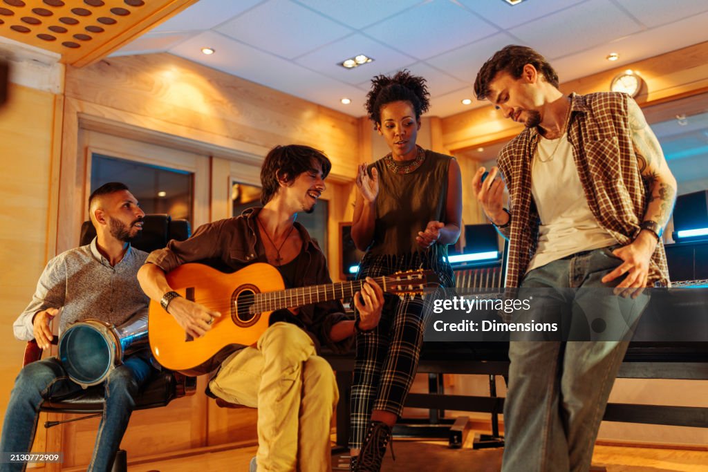 Artists having a studio session and playing instruments