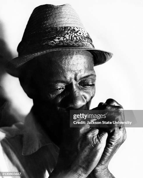"Little Son" Jefferson plays blues harmonica in Mississippi.