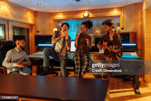 four friends jamming in the studio - jam session stock pictures, royalty-free photos & images