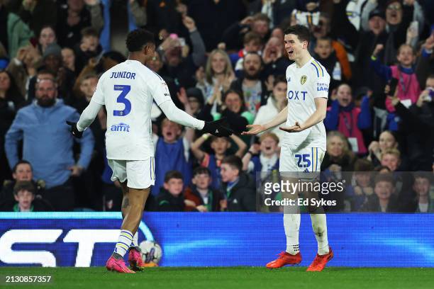 Sam Byram of Leeds United celebrates scoring his team's first goal with teammate Junior Firpo during the Sky Bet Championship match between Leeds...
