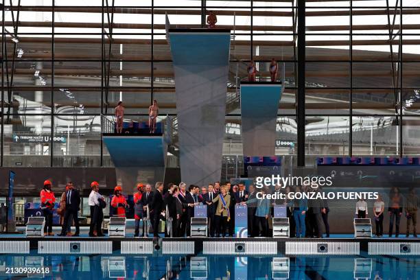 French President Emmanuel Macron and officials attend the inauguration of the Olympic aquatics centre , a multifunctional venue for the Paris 2024...