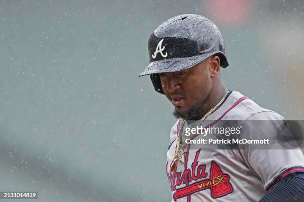 Ozzie Albies of the Atlanta Braves looks on in the rain during the eighth inning against the Chicago White Sox at Guaranteed Rate Field on April 01,...