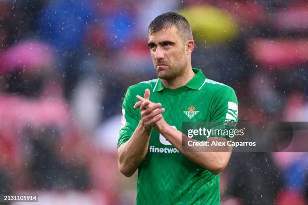 Sokratis Papastathopoulos of Real Betis applauds the supporters following the LaLiga EA Sports match between Girona FC and Real Betis at Montilivi...