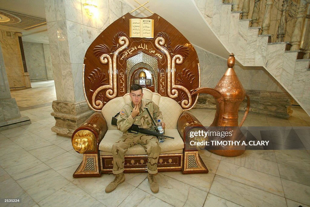 A US soldier sits in a seat at the Radwa