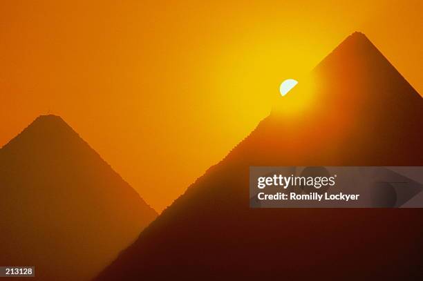 pyramids at sunset - giza, egypt - giza pyramids stock pictures, royalty-free photos & images