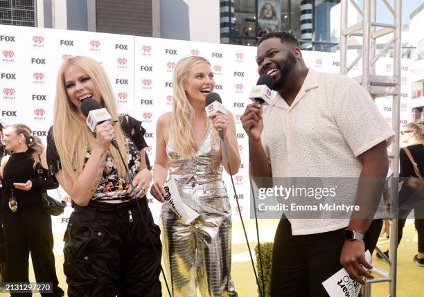 Avril Lavigne, Tanya Rad, and EJ attend the 2024 iHeartRadio Music Awards at Dolby Theatre in Los Angeles, California on April 01, 2024. Broadcasted...