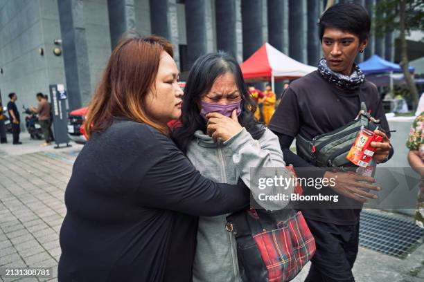 Woman is reunited with her family after being rescued from the Silks Place Taroko Hotel following an earthquake in Hualien, Taiwan, on Thursday,...