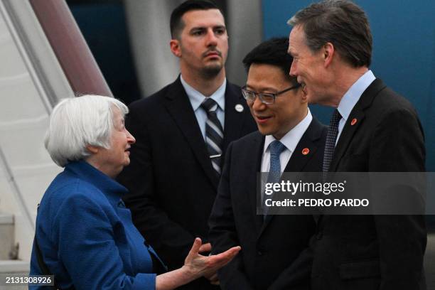 China's Vice Minister of Finance Liao Min and US Ambassador to China Nicholas Burns receive US Treasury Secretary Janet Yellen upon her arrival at...