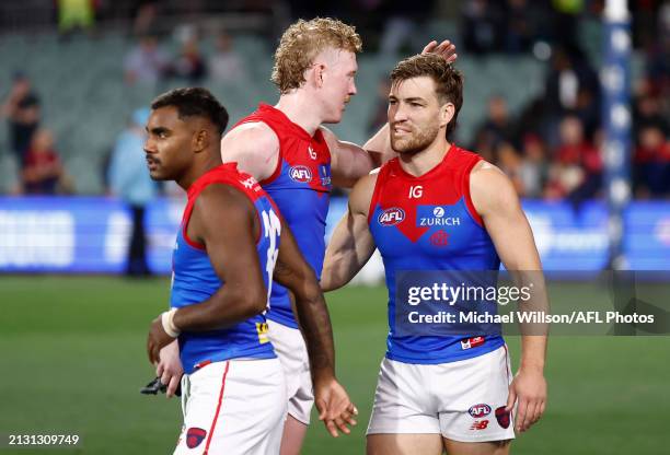 Kysaiah Pickett, Clayton Oliver and Jack Viney of the Demons celebrate during the 2024 AFL Round 04 match between the Adelaide Crows and the...