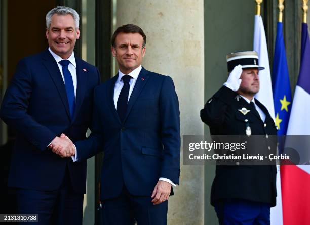 France's President Emmanuel Macron poses with Austrian Chancellor Karl Nehammer at Elysee Palace on April 4, 2024 in Paris, France. The President of...