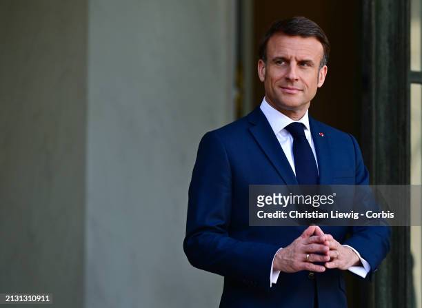 France's President Emmanuel Macron waits upon the arrival of Austrian Chancellor Karl Nehammer at Elysee Palace on April 4, 2024 in Paris, France....