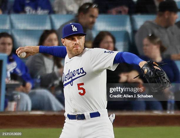 Los Angeles, CA Dodgers first baseman Freddie Freeman throws the ball against the Giants at Dodger Stadium in Los Angeles Tuesday, April 2, 2024.