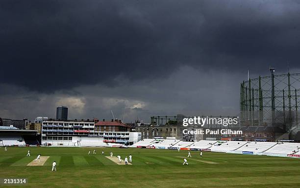 General view of rain clouds above the Oval during the Frizzell county championship, division one, day one of four, match between Surrey and Kent at...