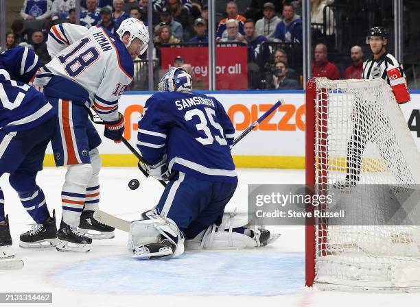 Toronto Maple Leafs goaltender Ilya Samsonov stops Edmonton Oilers left wing Zach Hyman as the Toronto Maple Leafs play the Edmonton Oilers at...