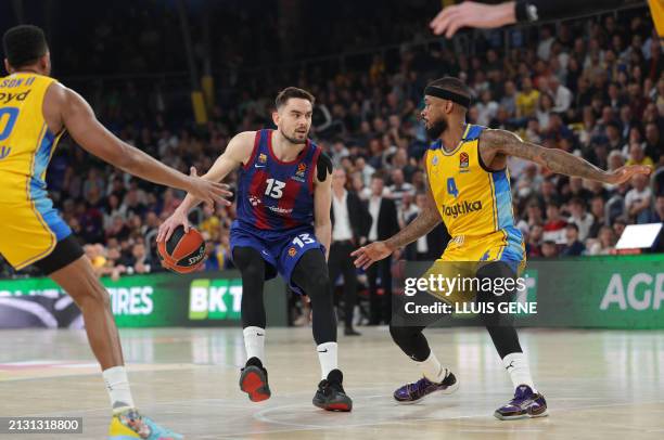 Barcelona's Czech guard Tomas Satoransky vies with Maccabi's US guard Lorenzo Brown during the Euroleague basketball match between FC Barcelona and...