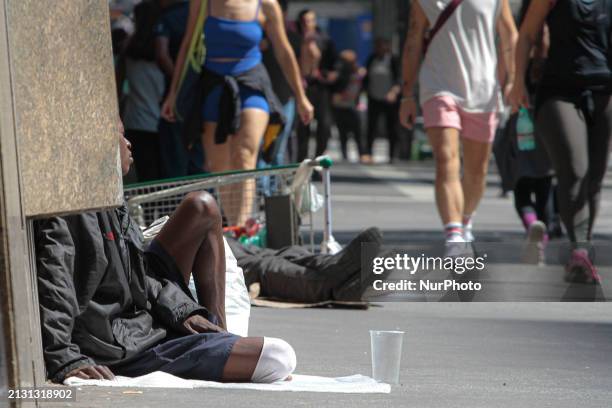 People are experiencing homelessness on Avenida Paulista in the central region of Sao Paulo, Brazil, on Thursday, April 4, 2024.