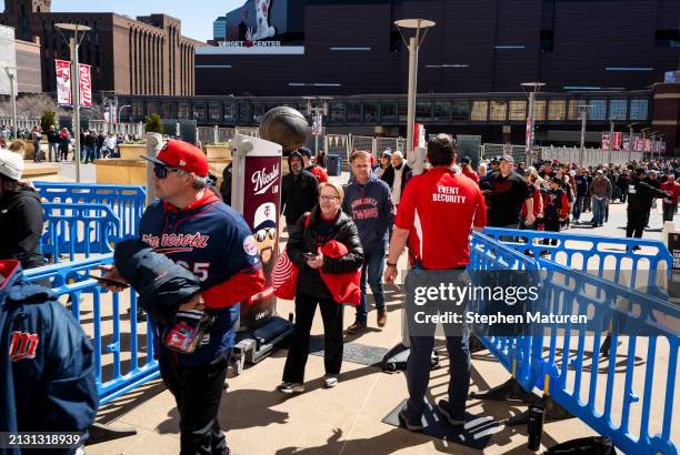 Fans enter the gates before the home opener between the Cleveland Guardians and Minnesota Twins at Target Field on April 4, 2024 in Minneapolis,...