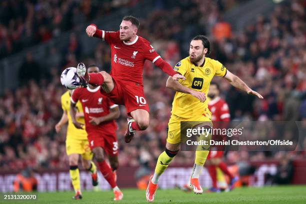 Alexis Mac Allister of Liverpool gets to the ball ahead of Ben Brereton Diaz of Sheffield United during the Premier League match between Liverpool FC...