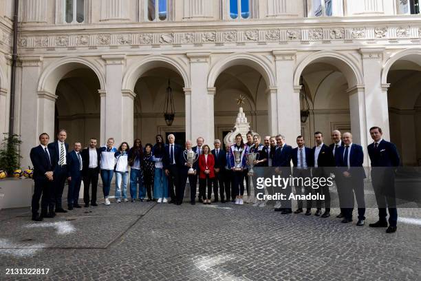 Italian Prime Minister Giorgia Meloni poses for a photo with volleyball players in the courtyard of the Chigi Palace in Rome, Italy on April 04,...