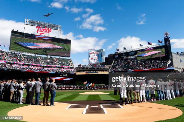 Members of the Minnesota Twins line up for the national anthem before the home opener at Target Field on April 4, 2024 in Minneapolis, Minnesota.