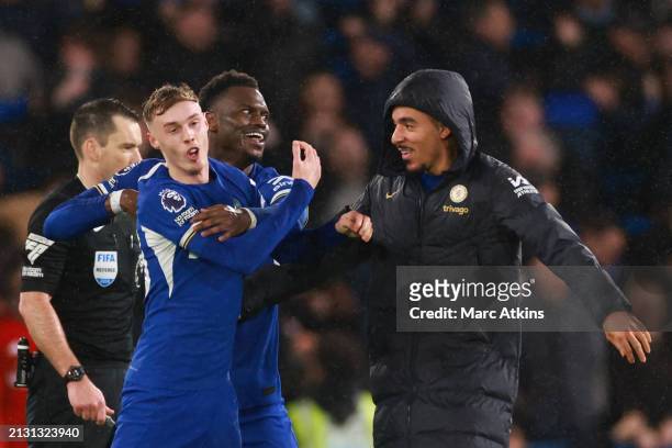 Cole Palmer of Chelsea celebrates scoring the fourth goal with Benoit Badiashile and Malo Gusto of Chelsea during the Premier League match between...